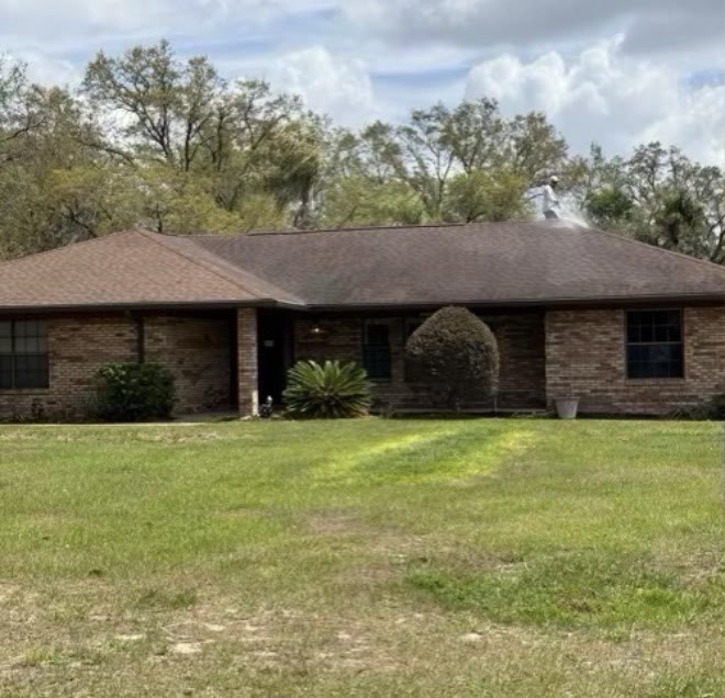 Residential shingle roof · Central FL — before cleaning